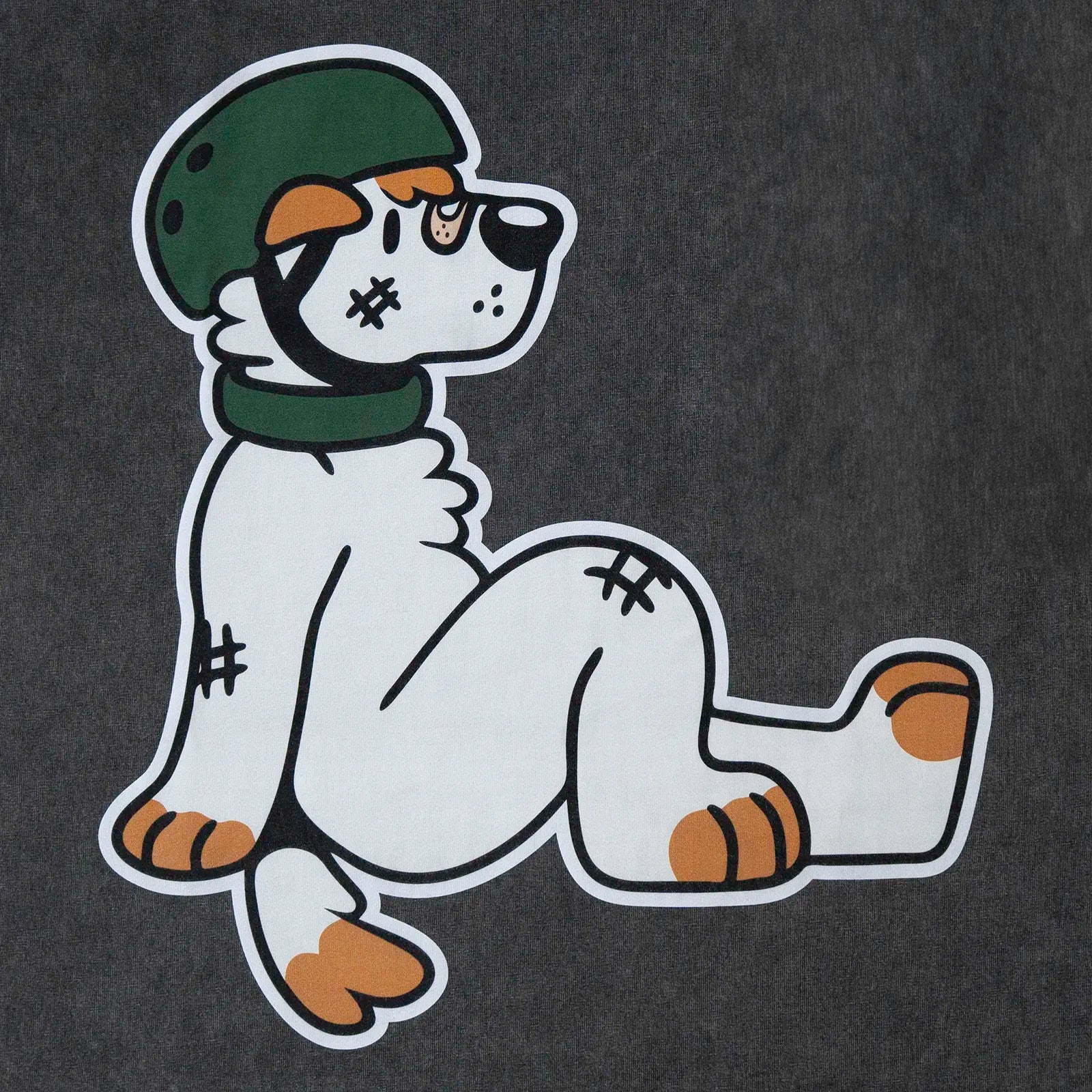 Close-up of the Ollie skater dog back print on an acid-wash grey oversized tee—cute animal furry merch.