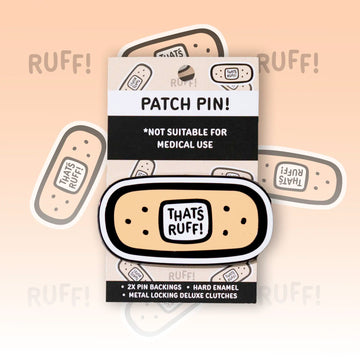 Front view of a bandage logo hard-enamel lapel pin from That's Ruff with glossy finish and deluxe locking pin backs—cute furry accessory for bags, jackets, or ita bags.