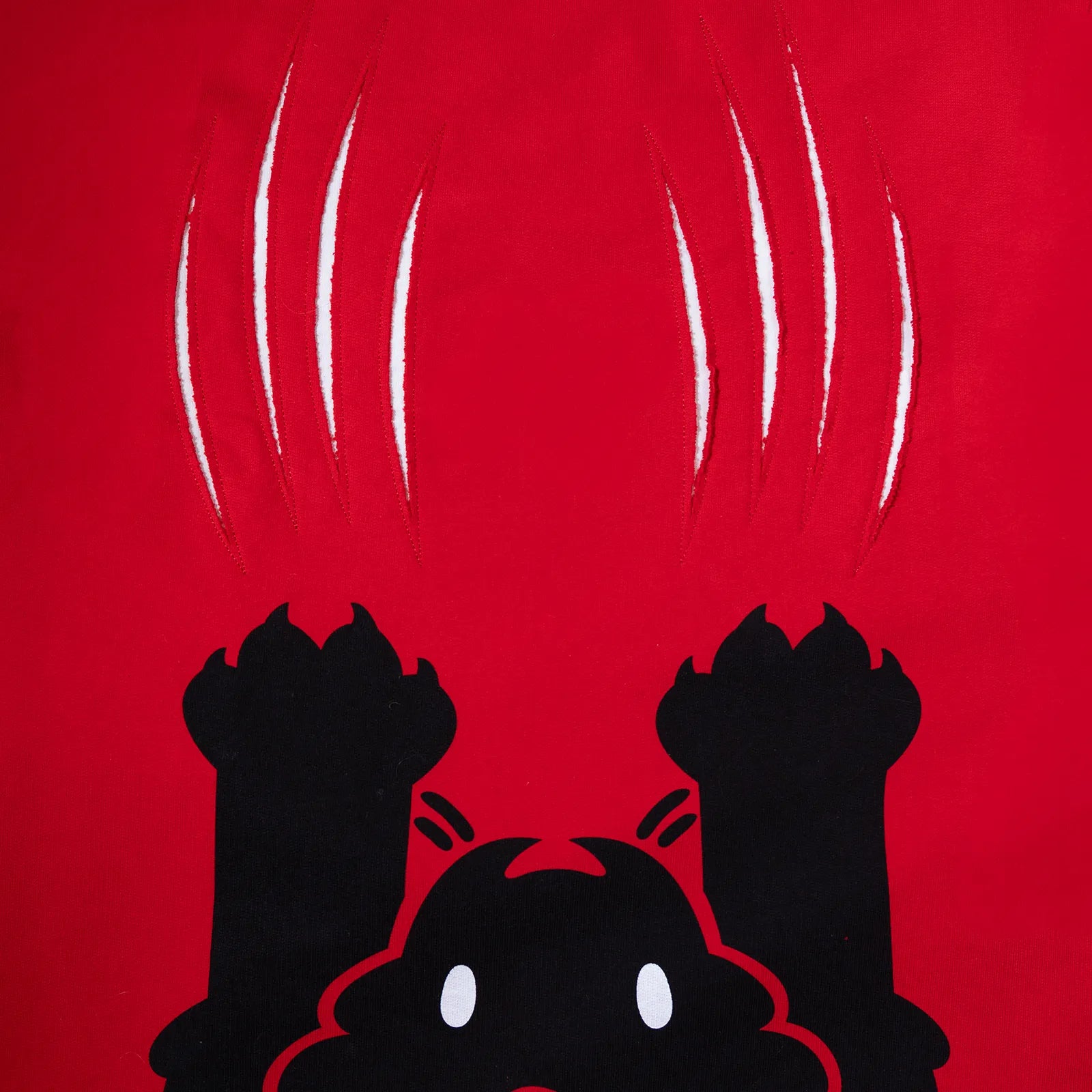 Black silhouette of a cat with claws on a red background