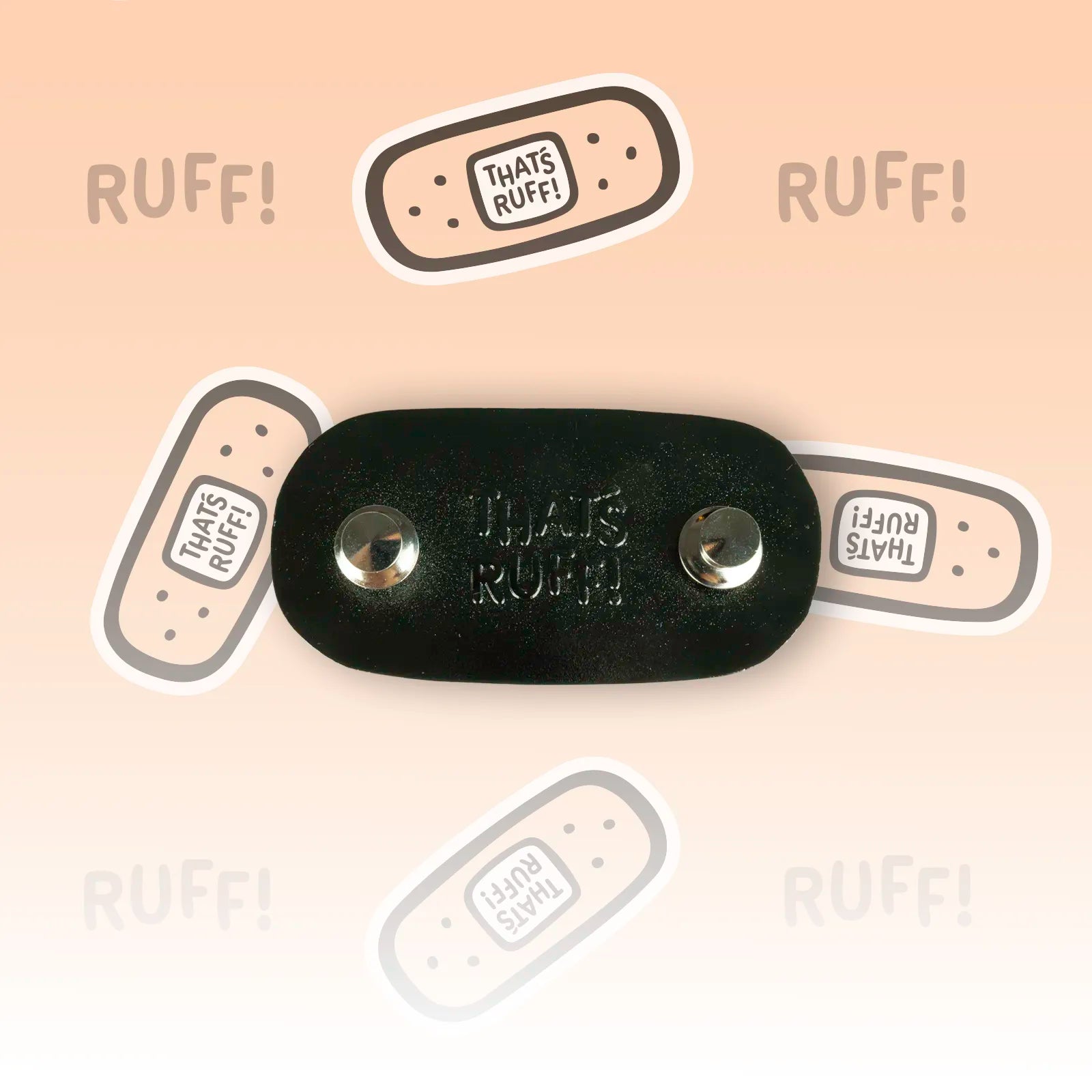 Reverse side of the That's Ruff bandage logo enamel pin showing two metal locking pin backs and maker stamp—sturdy collectible pin for furry merch fans.