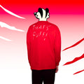 Person wearing a red sweatshirt with 'THAT'S RUFFI' text on the back, against a red and white background.