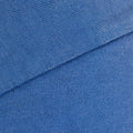 Blue 260gsm heavyweight cotton fabric detail with spray-dyed fade from an oversized tee—durable furry clothing.