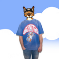 Model wearing a blue oversized cotton tee with “Hang In There” cat hang-glider graphic—furry streetwear/furry merch.