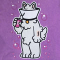 Close-up of the Samoyed “Lamp” front print on a washed purple oversized tee—cute animal print furry apparel/furry merch.