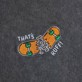 Chest embroidery close-up of the broken-skateboard logo on a grey oversized tee—kawaii skater streetwear for furry clothing fans.
