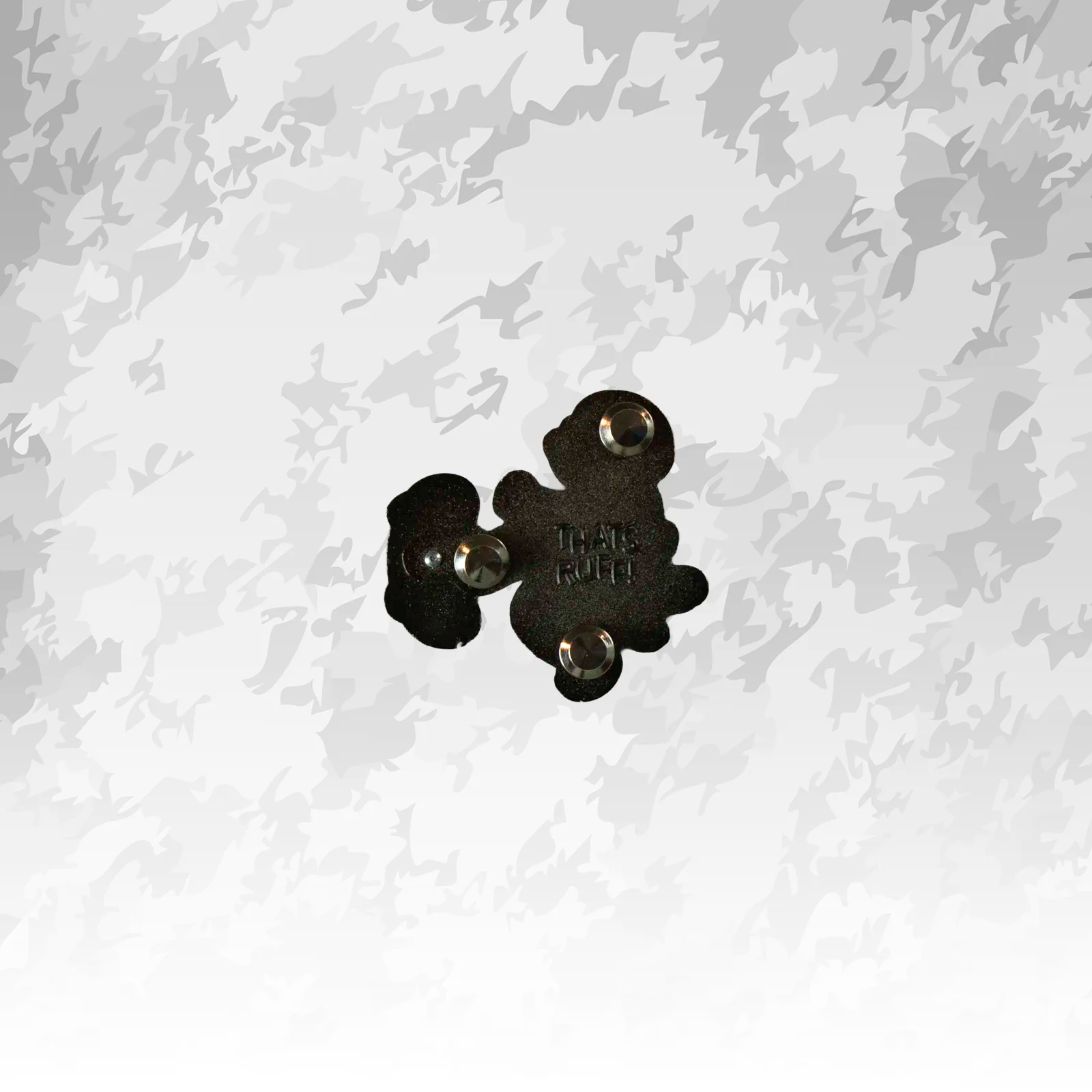 Reverse of the wipeout dog pin showing three posts, sturdy metal backs, and THAT'S RUFF stamp—durable hard-enamel construction.