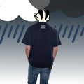 Back view showing THAT'S RUFF back-neck embroidery on a dark navy heavyweight pocket tee—furry clothing.
