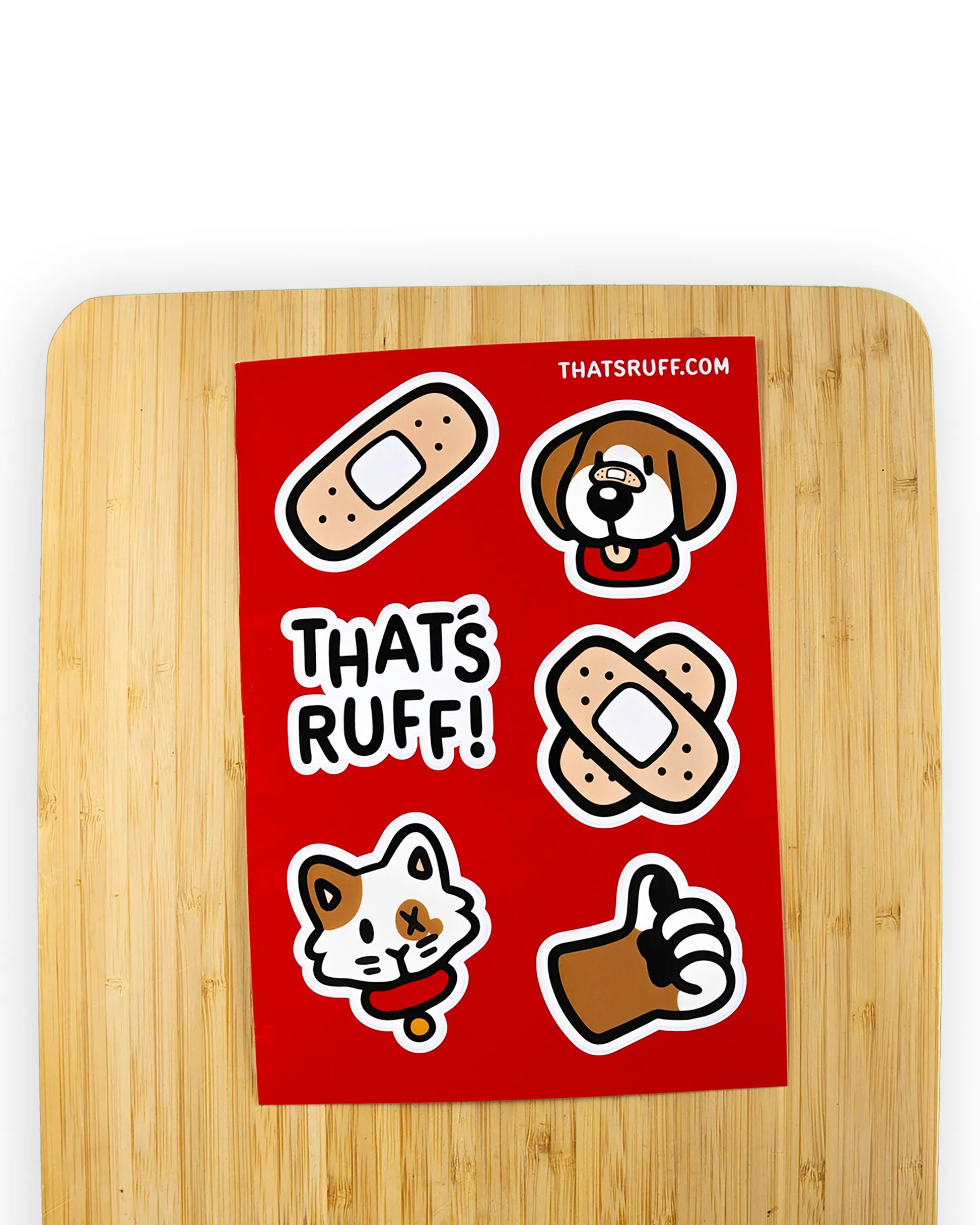 Bright red sticker sheet from the 'That's Ruff!' collection featuring playful cartoon designs, including a bandaged dog, cat, thumbs-up paw, and bandage graphics. Perfect for adding bold and expressive style to your laptop, water bottle, or personal accessories.