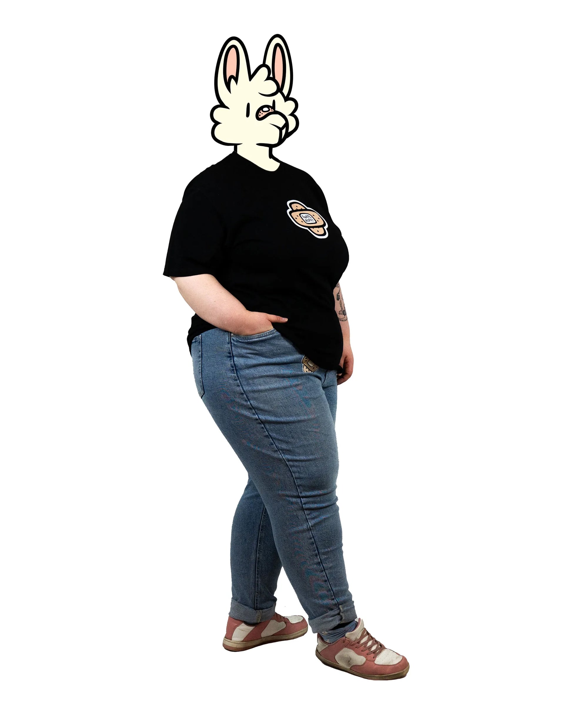 Side profile of a model wearing a black t-shirt featuring the iconic That's Ruff! bandage design on the chest. Perfectly styled with casual jeans and sneakers for a laid-back, playful look.