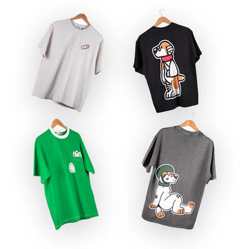Collection of graphic t-shirts from the 'That's Ruff!' series, featuring playful designs on gray, black, green, and stone-washed fabric. Designs include cartoon animals, bandages, and bold streetwear-inspired artwork. Perfect for casual wear and showcasing unique, creative style.