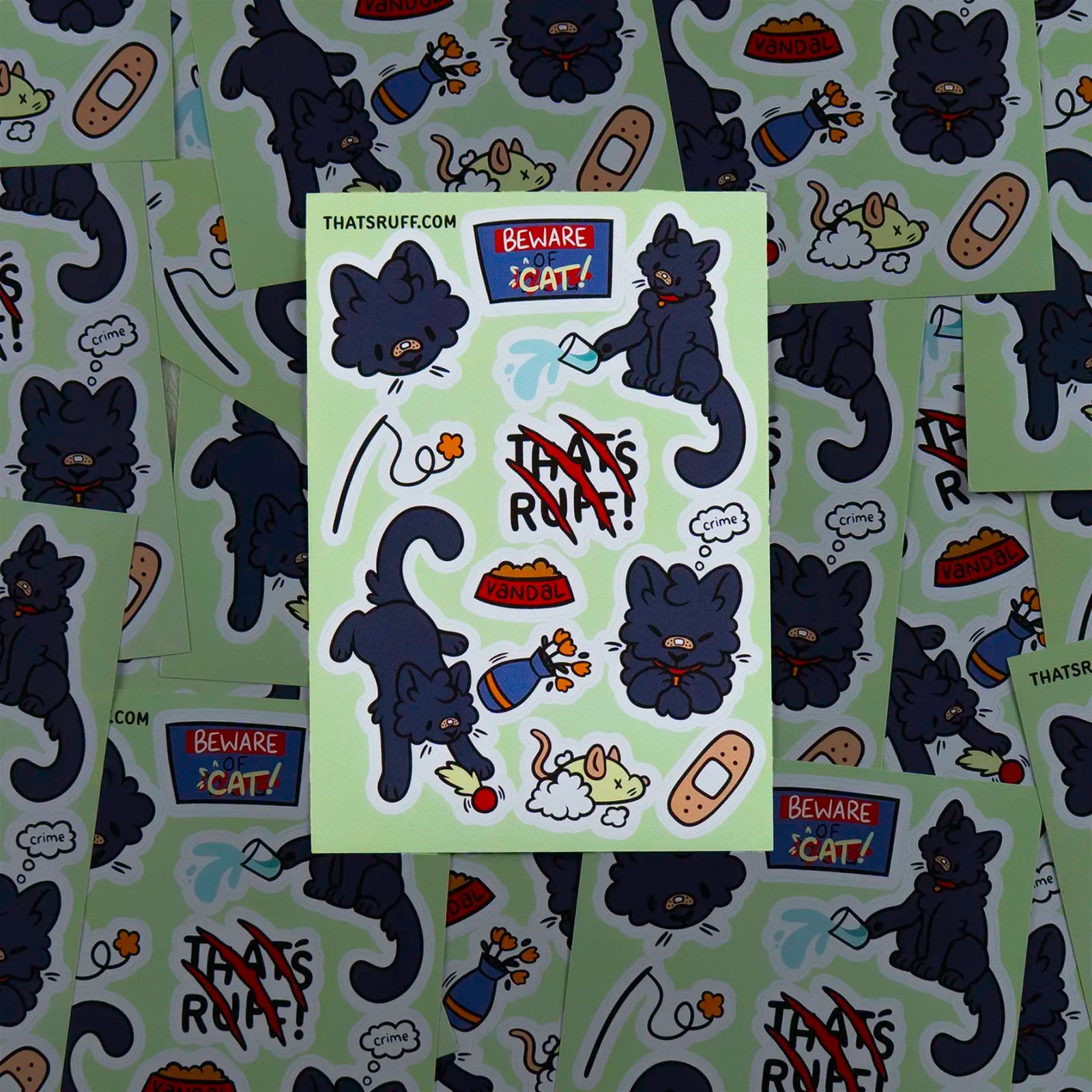 Spread of Vandal black cat sticker sheets; sustainable plant-based decals for journals, skate gear, and cases.